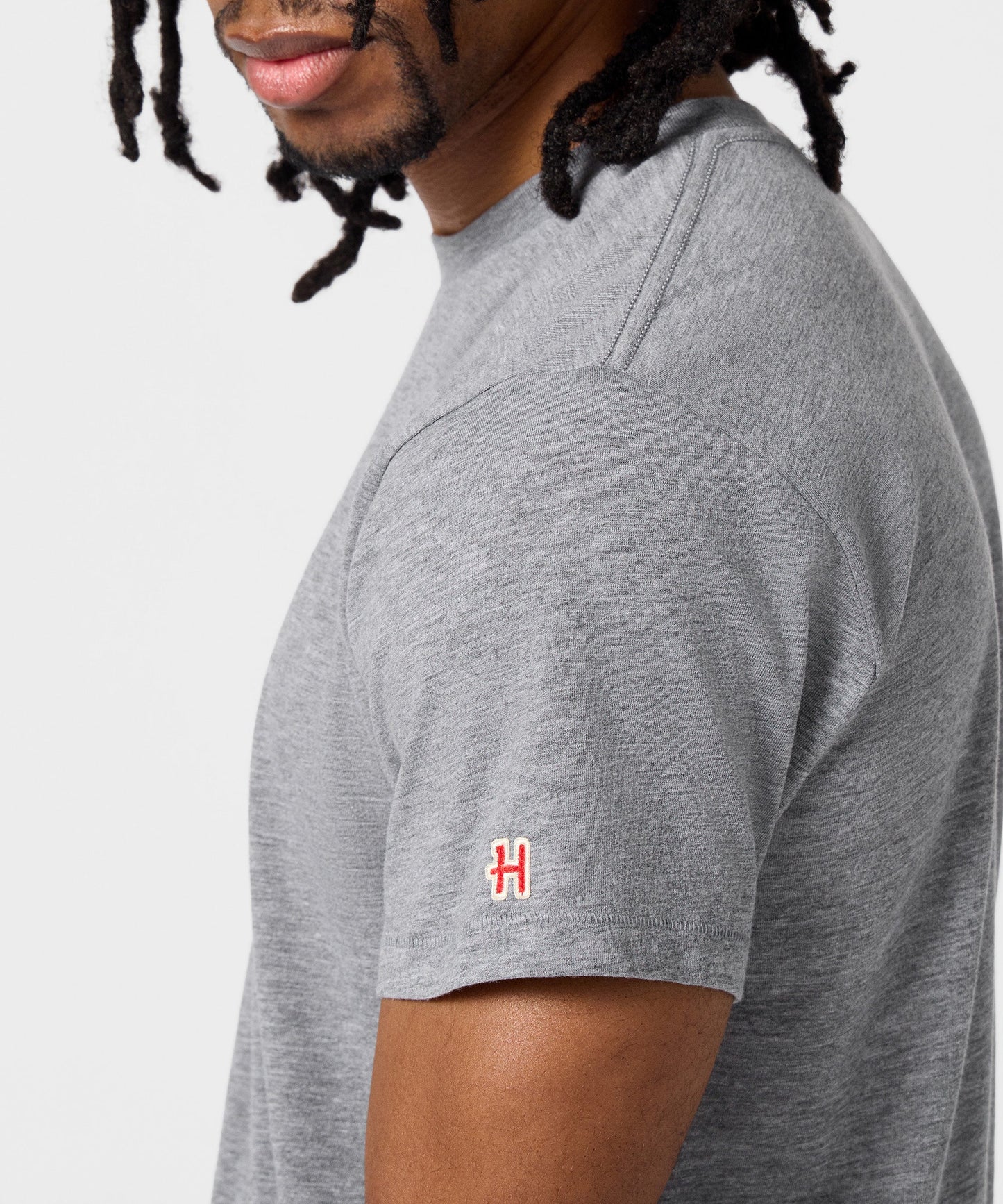 Folded grey t-shirt showing the soft fabric texture and front graphic