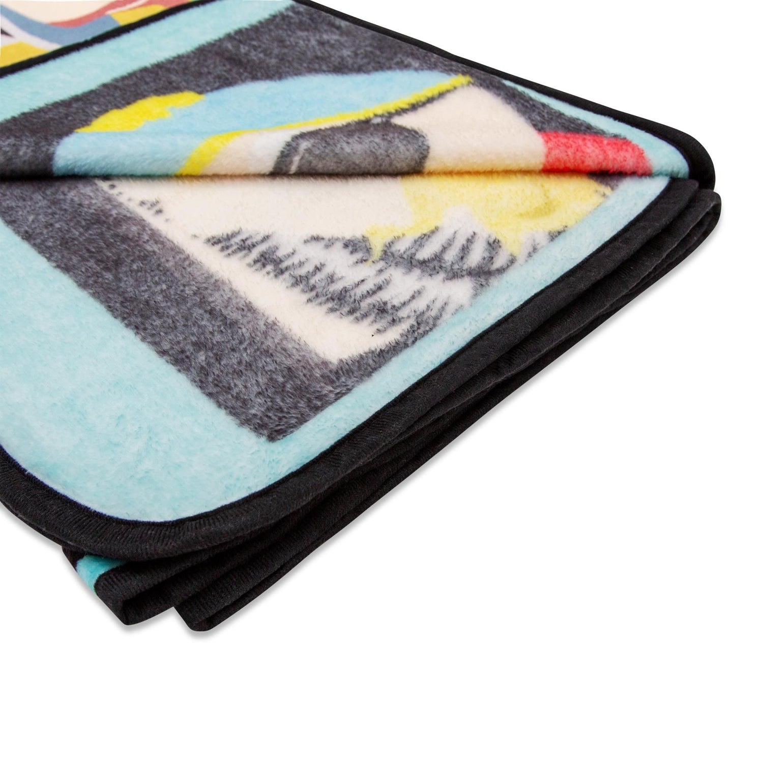 South Park throw blanket draped over a couch showcasing plush texture and vibrant graphics