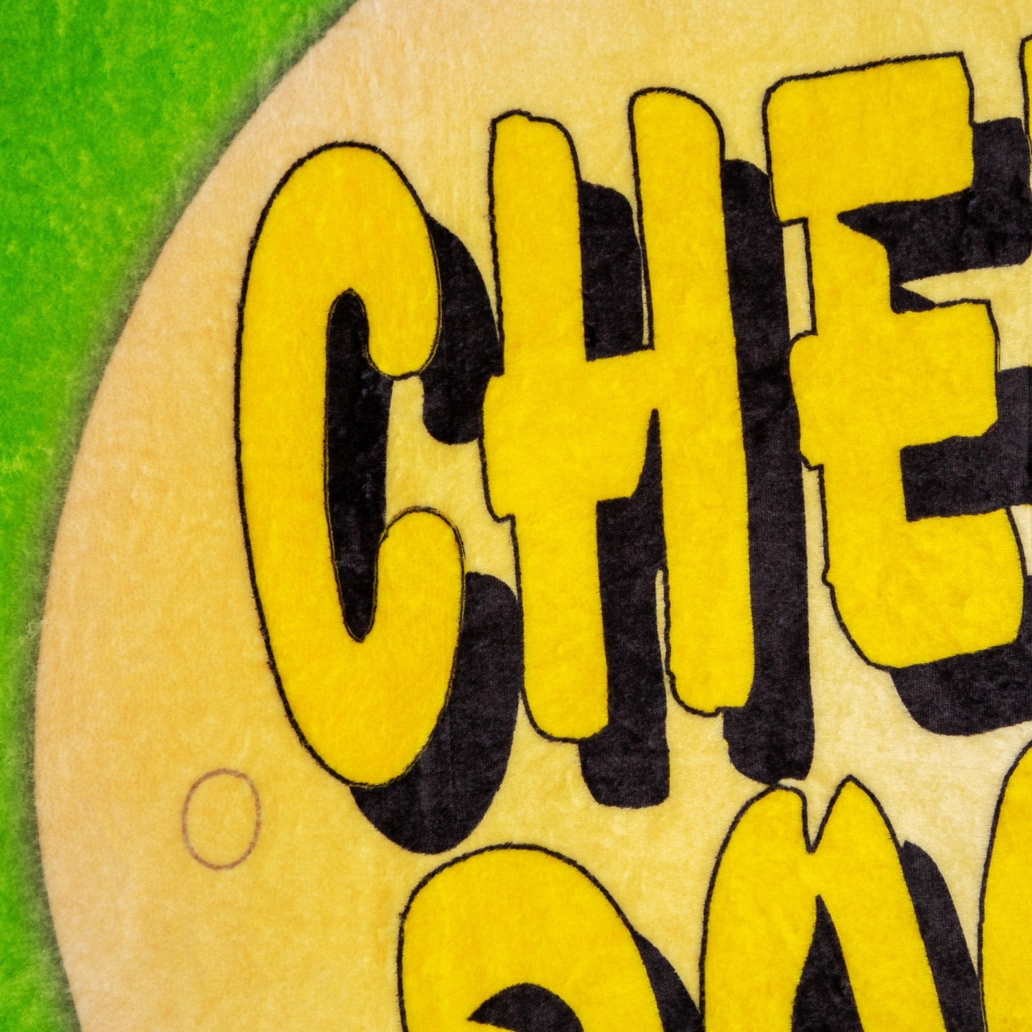 South Park Cheesy Poofs Raschel Throw Blanket draped over a couch
