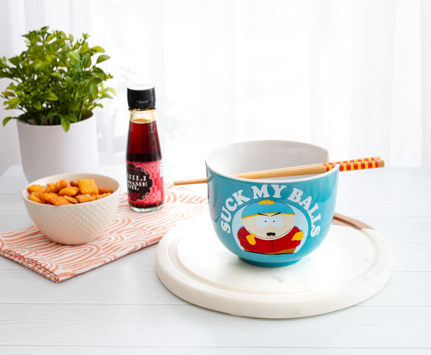 Side profile of the blue South Park ramen bowl with character artwork