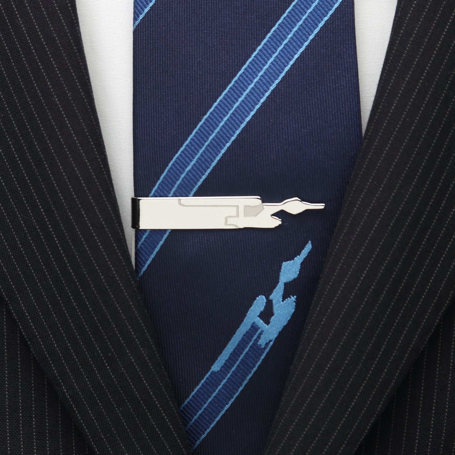 Detail of the scored metal USS Enterprise silhouette on tie bar