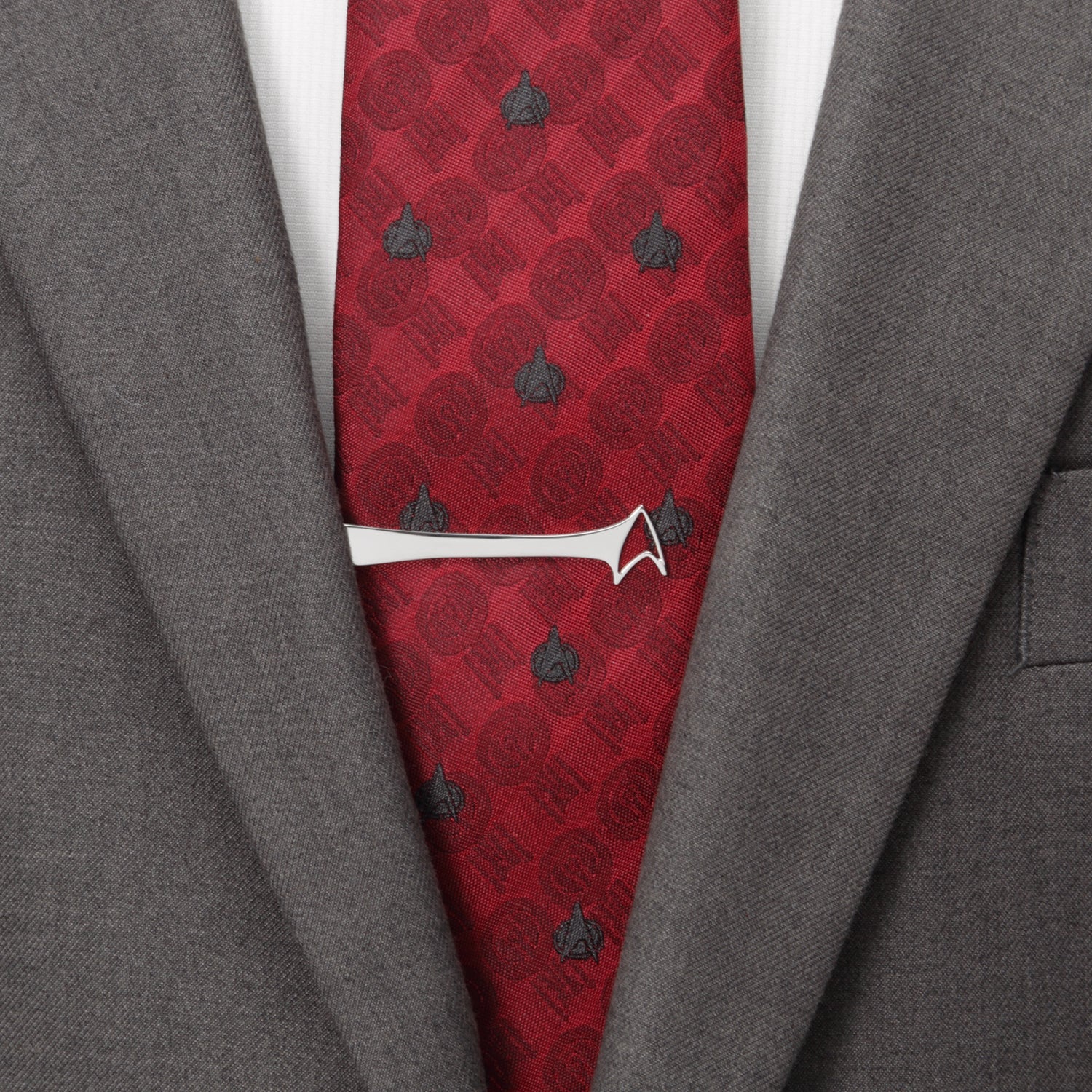 Detail shot of the Starfleet Delta insignia cutout on a silver tie bar