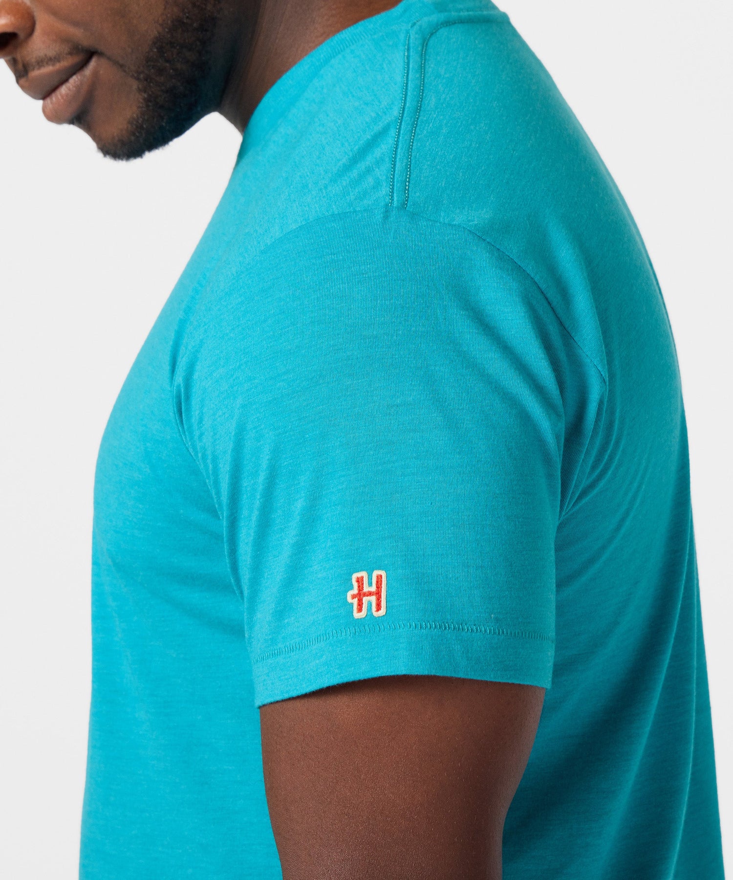 View of the plain back side of the charcoal t-shirt
