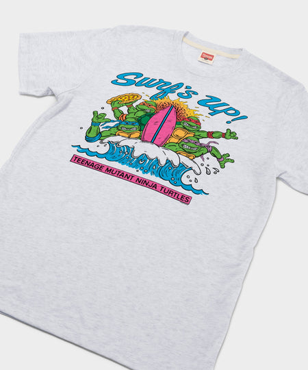 Close-up of the front graphic featuring TMNT characters surfing with a pizza slice