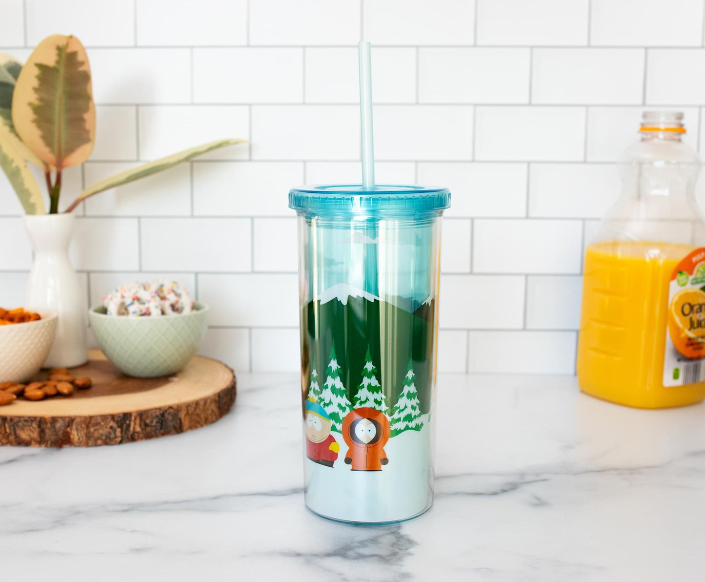 South Park tumbler shown with straw inserted against a neutral background