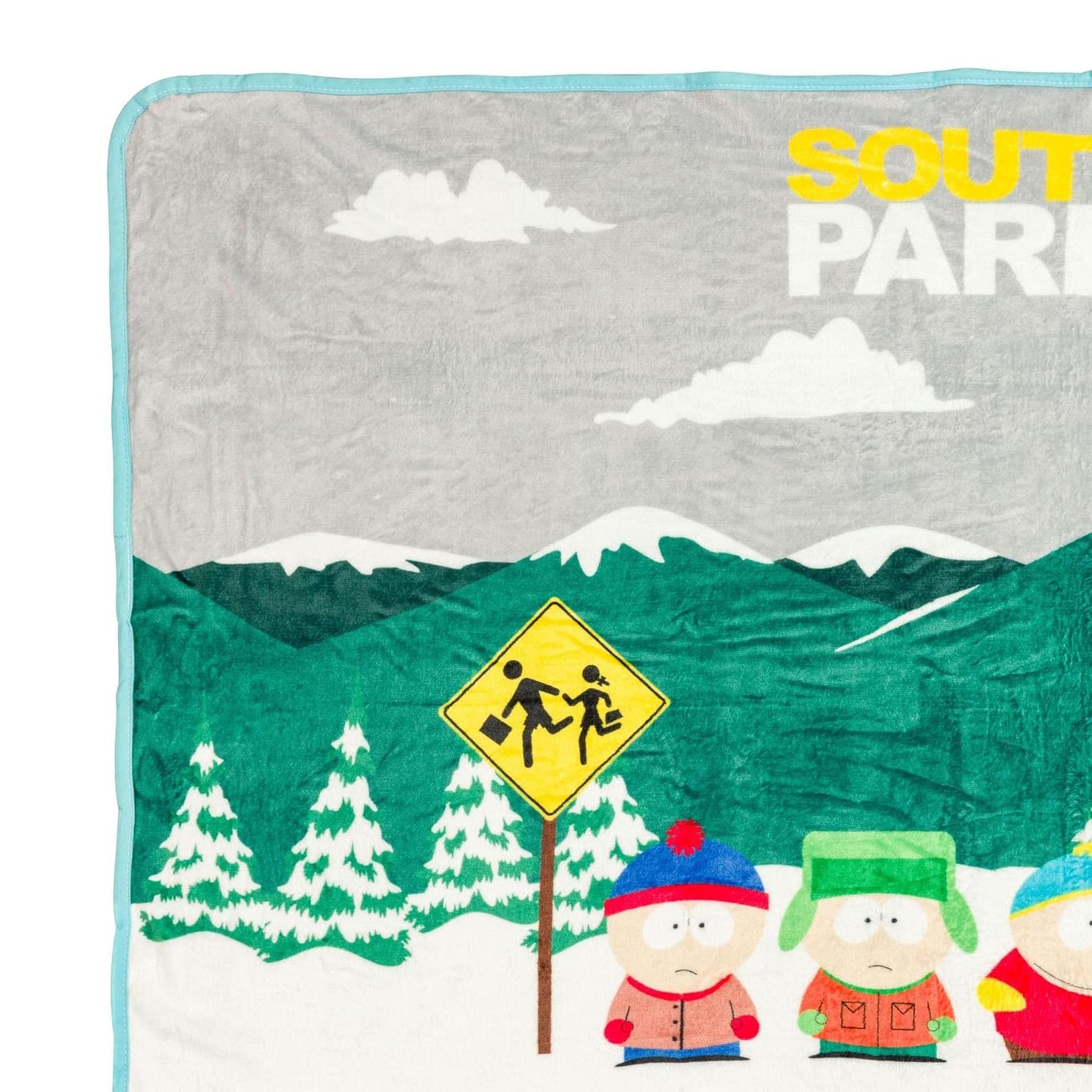 Folded South Park Bus Stop fleece blanket displaying the soft fabric texture