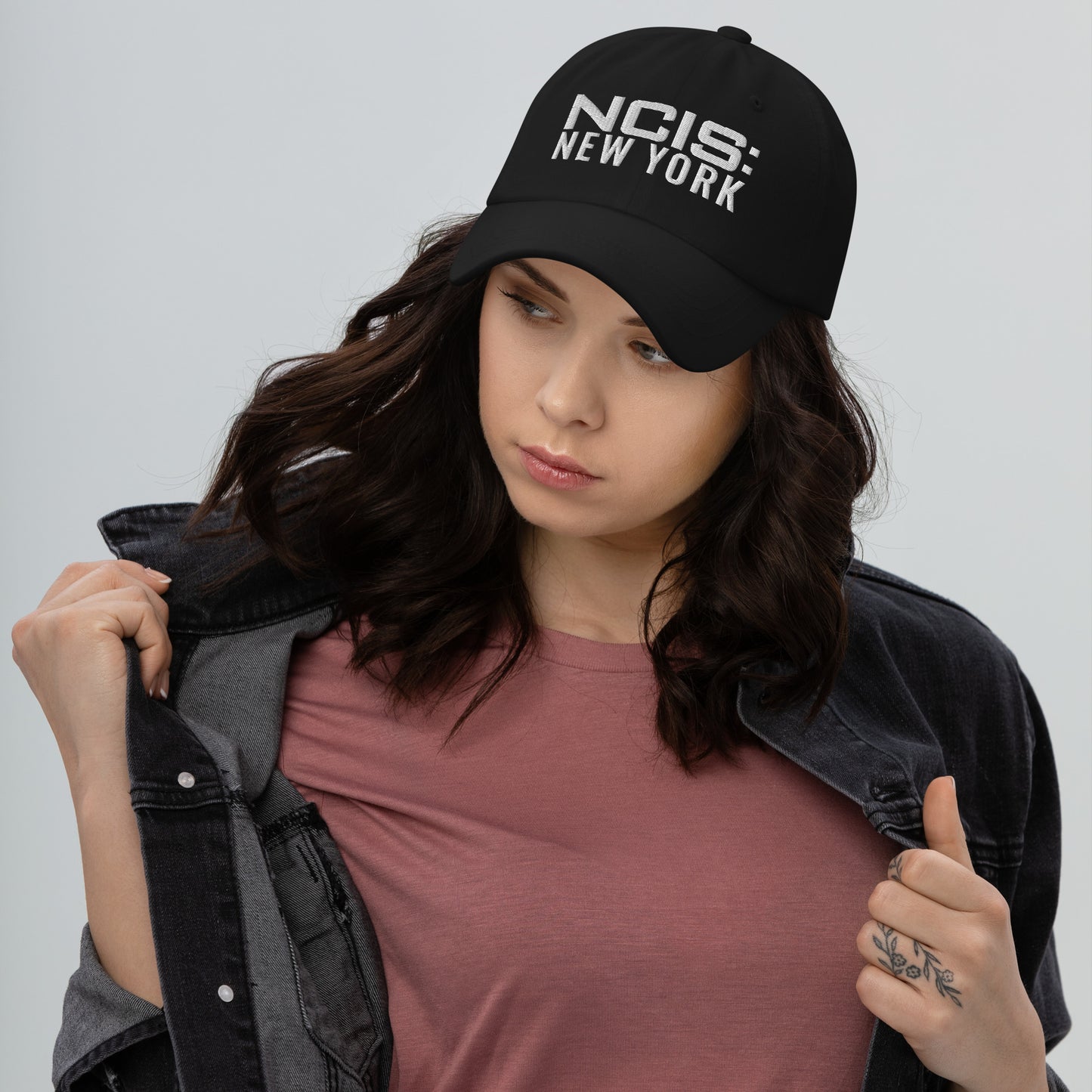 Close-up of the embroidered NCIS: New York logo on the front panel of the hat