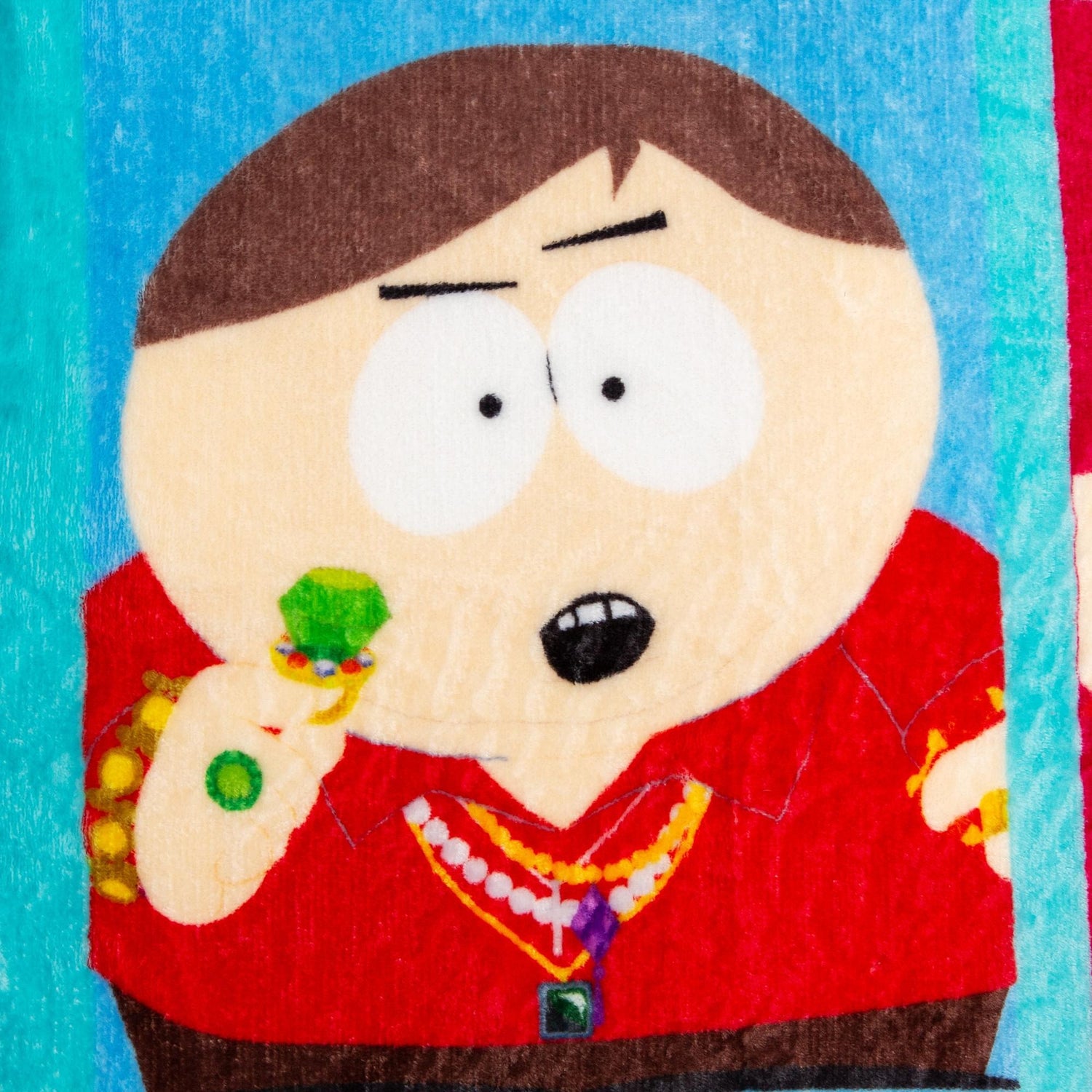 Close-up of South Park Eric Cartman blanket showing colorful character alter egos