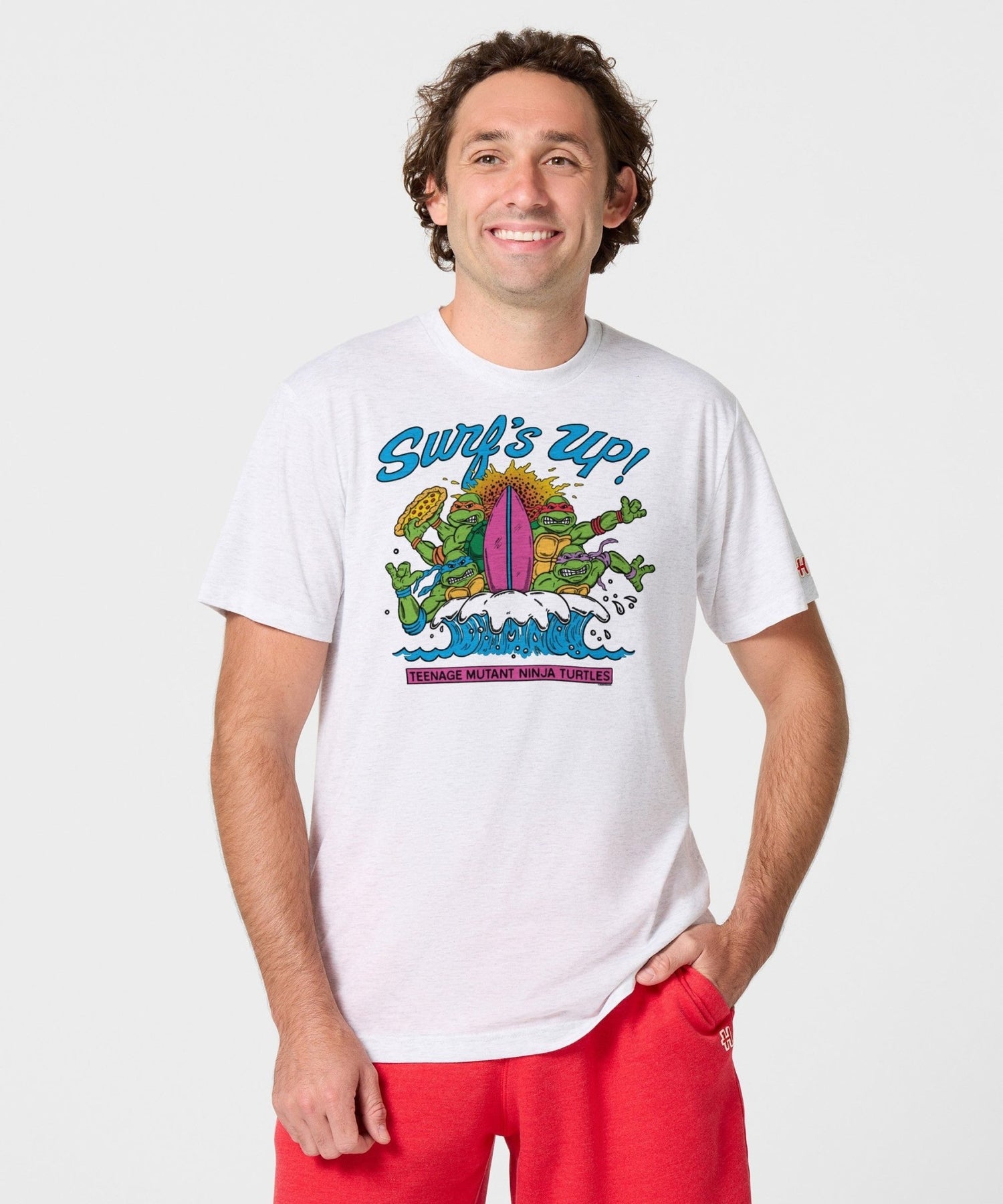 View of the t-shirt collar and interior neck label displaying the HOMAGE and Teenage Mutant Ninja Turtles branding