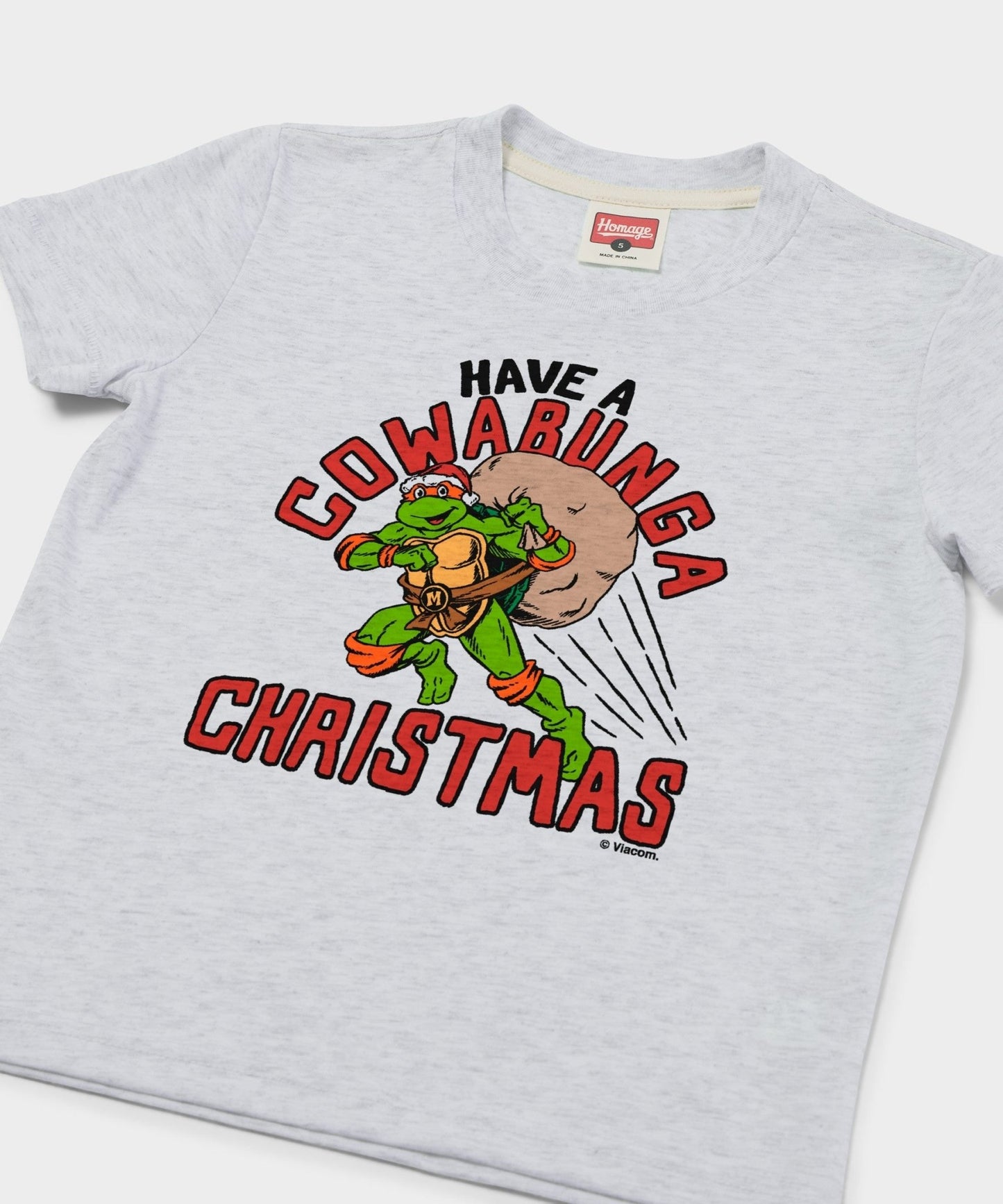 Close-up of the graphic print on the chest of the TMNT holiday youth t-shirt
