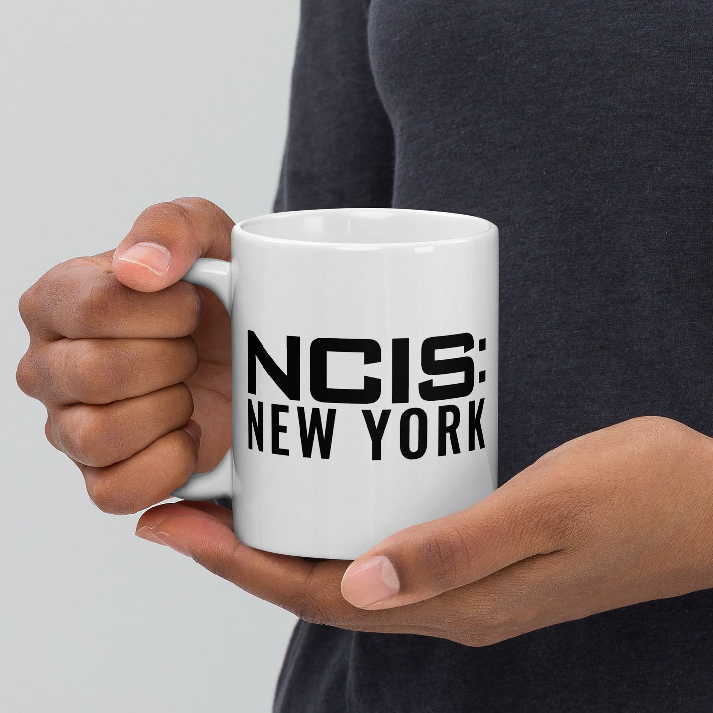 Side view of the white ceramic coffee mug with the handle facing right