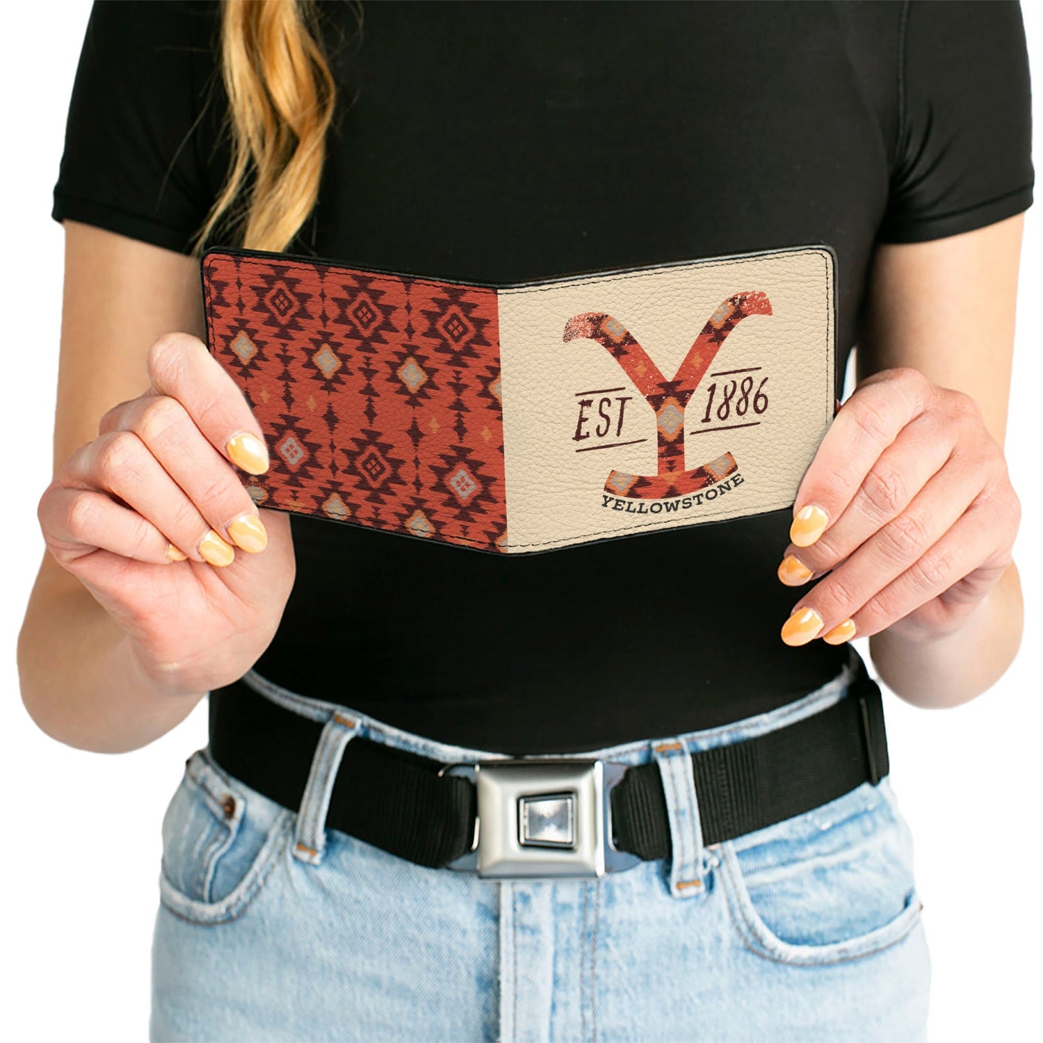 Wallet held in hand to show scale and tactile texture