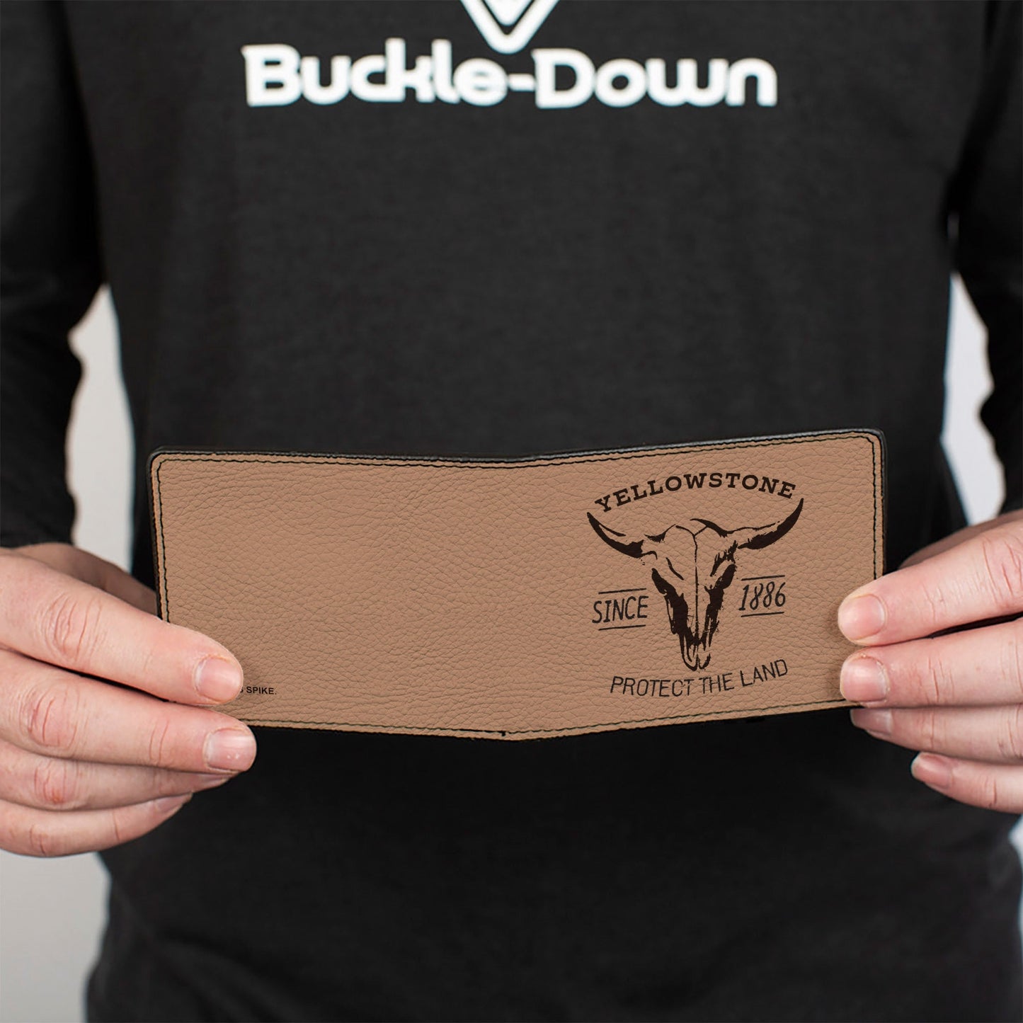 Folded view of the tan and brown bi-fold wallet showing color-block design