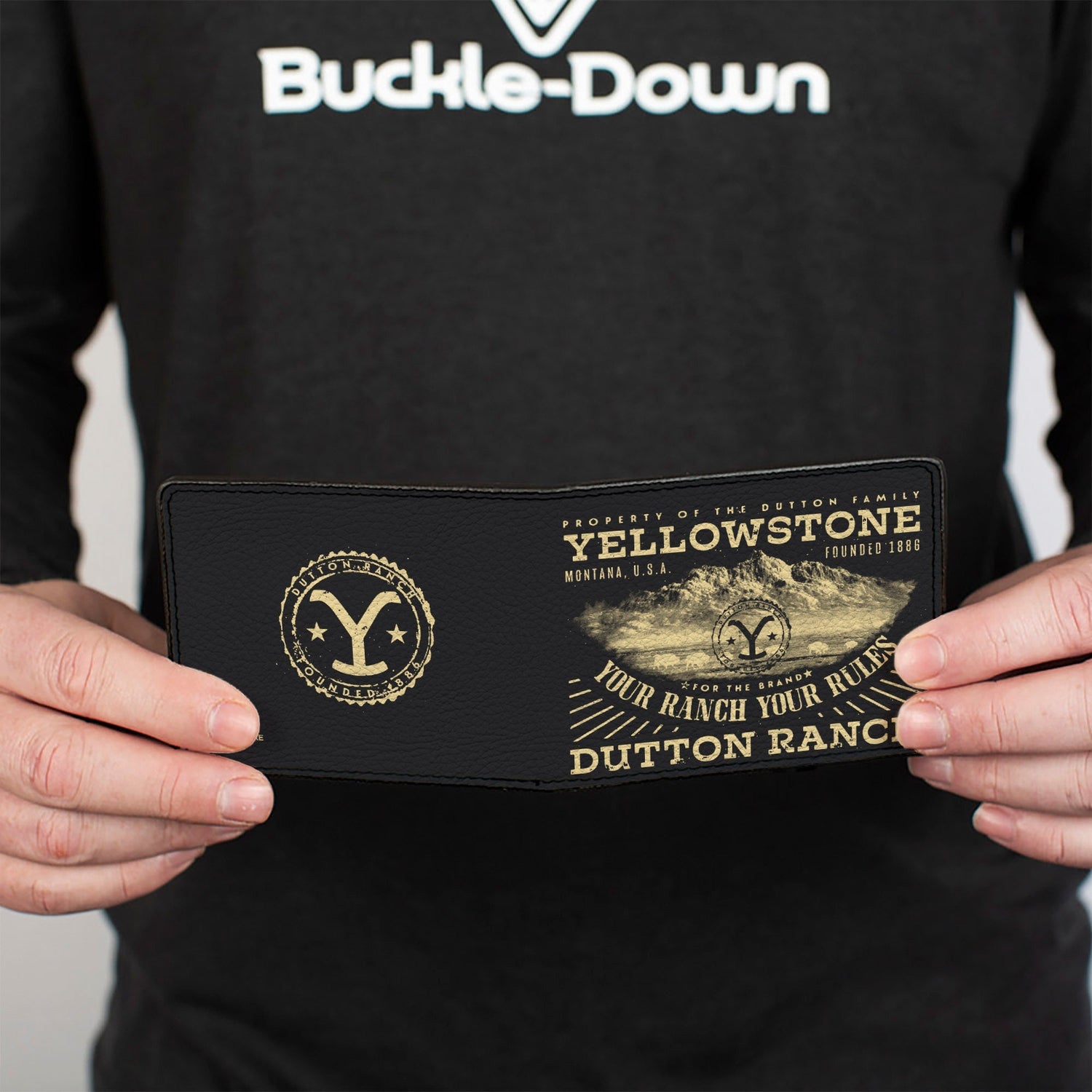 Official Yellowstone merchandise bi-fold wallet showing landscape design