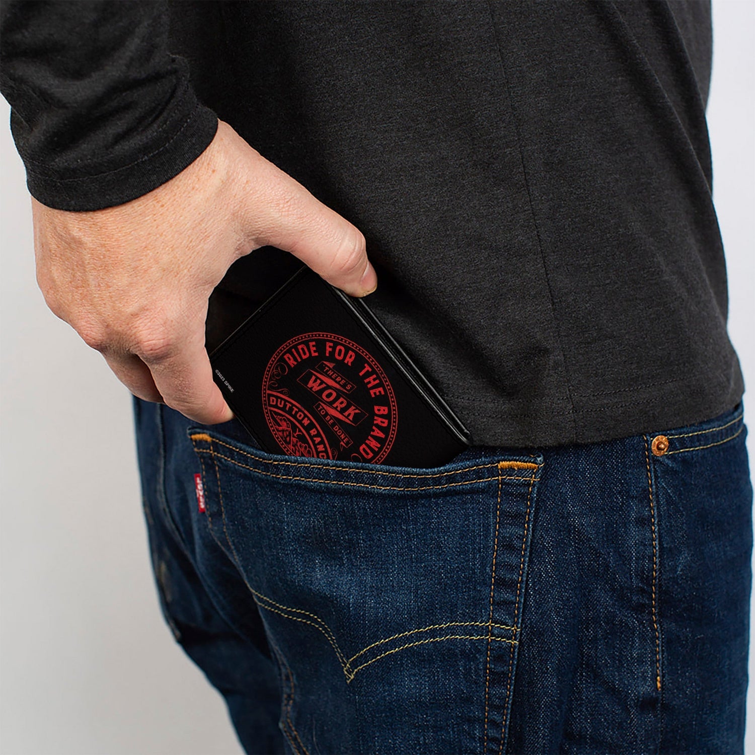 Side profile showing the slim design of the Dutton Ranch wallet.