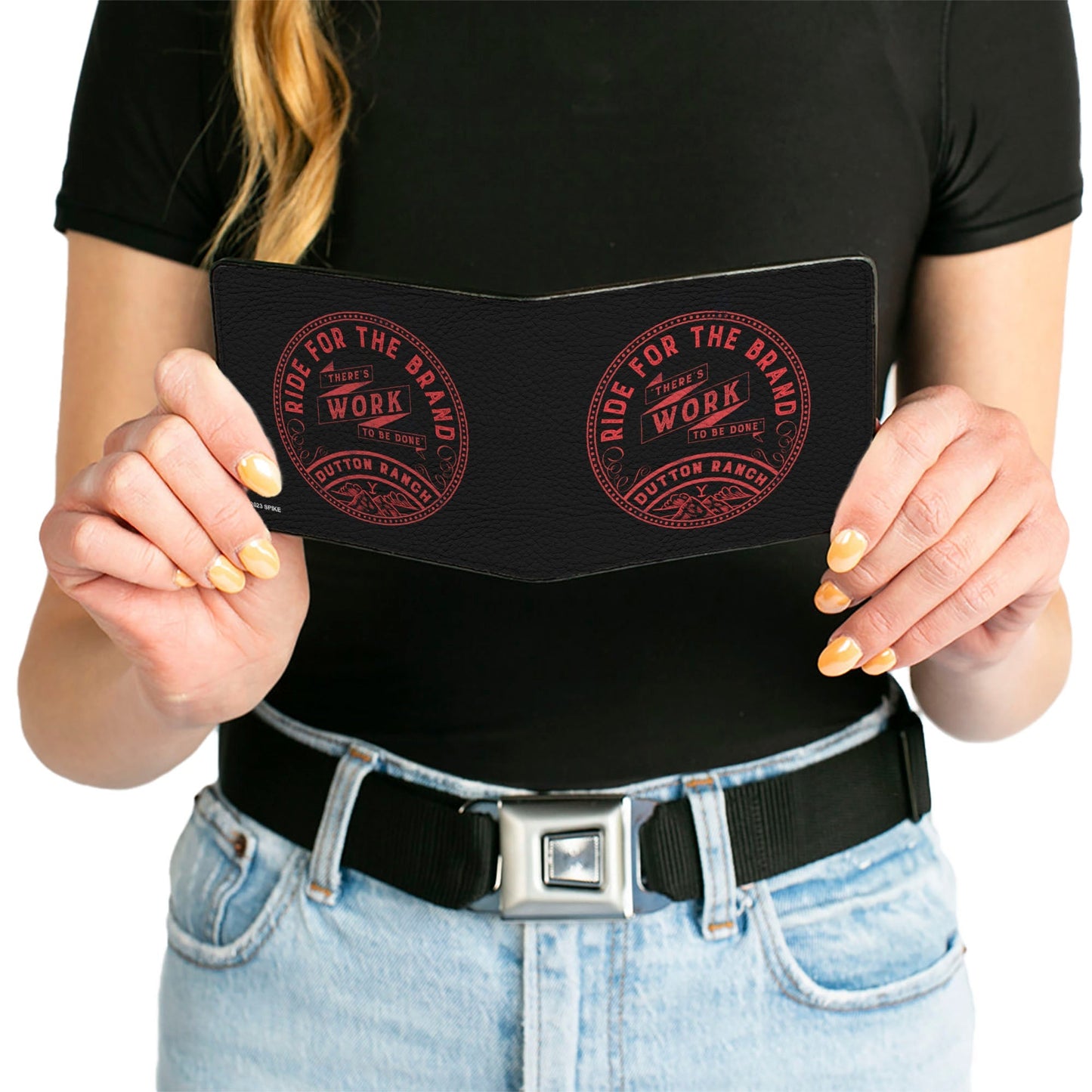 Wallet being held to show tactile vegan leather texture.
